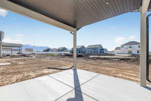 View of patio / terrace with a mountain view and a residential view