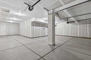 Garage featuring a garage door opener