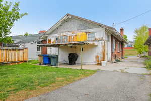 Rear view of property featuring a patio area