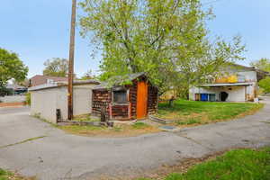 View of front of house featuring an outbuilding