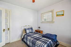 Bedroom with carpet floors and ceiling fan