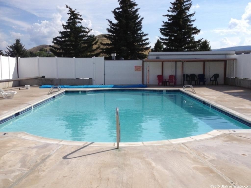 Community pool with a patio area