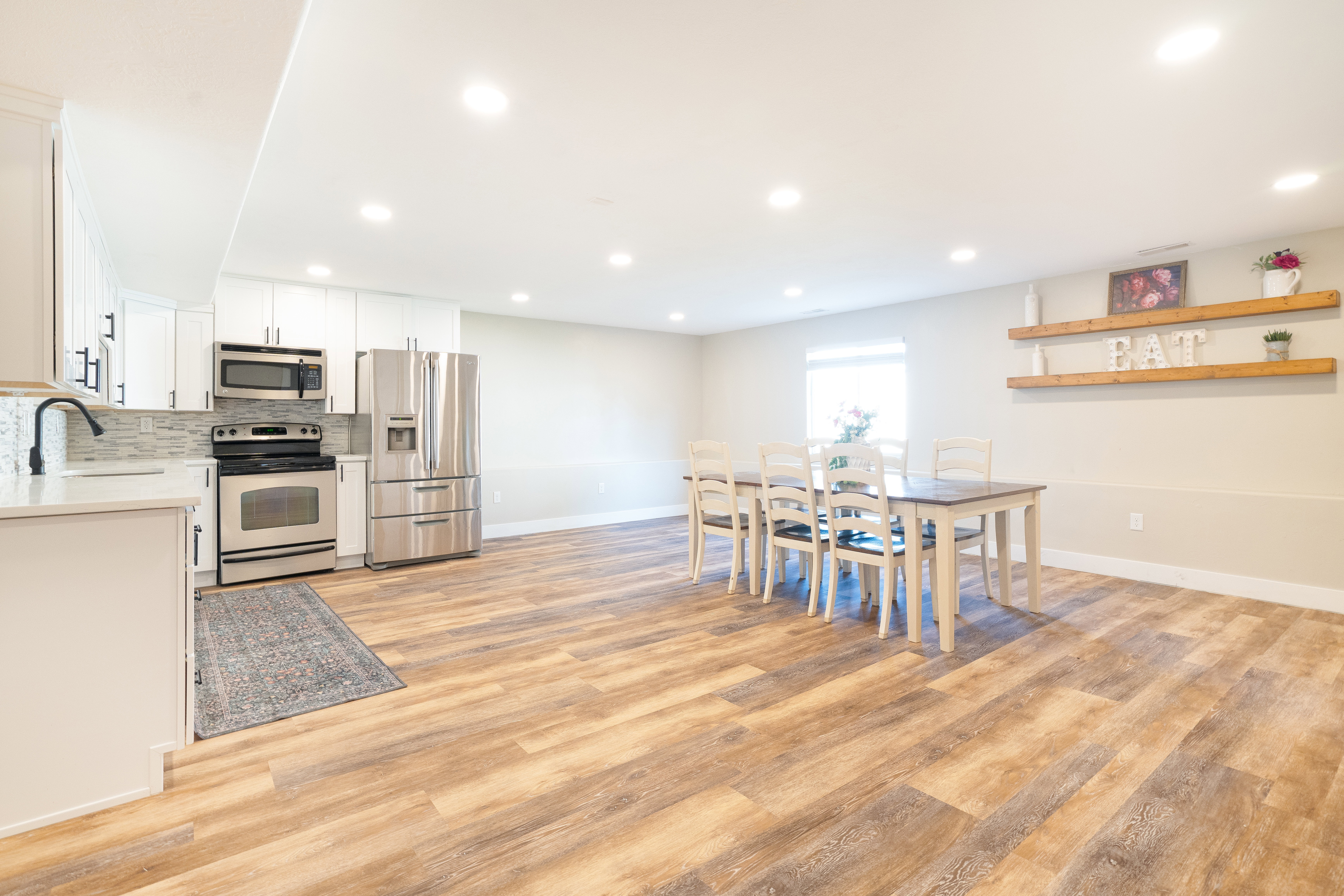 Dining space featuring light wood-style flooring and recessed lighting