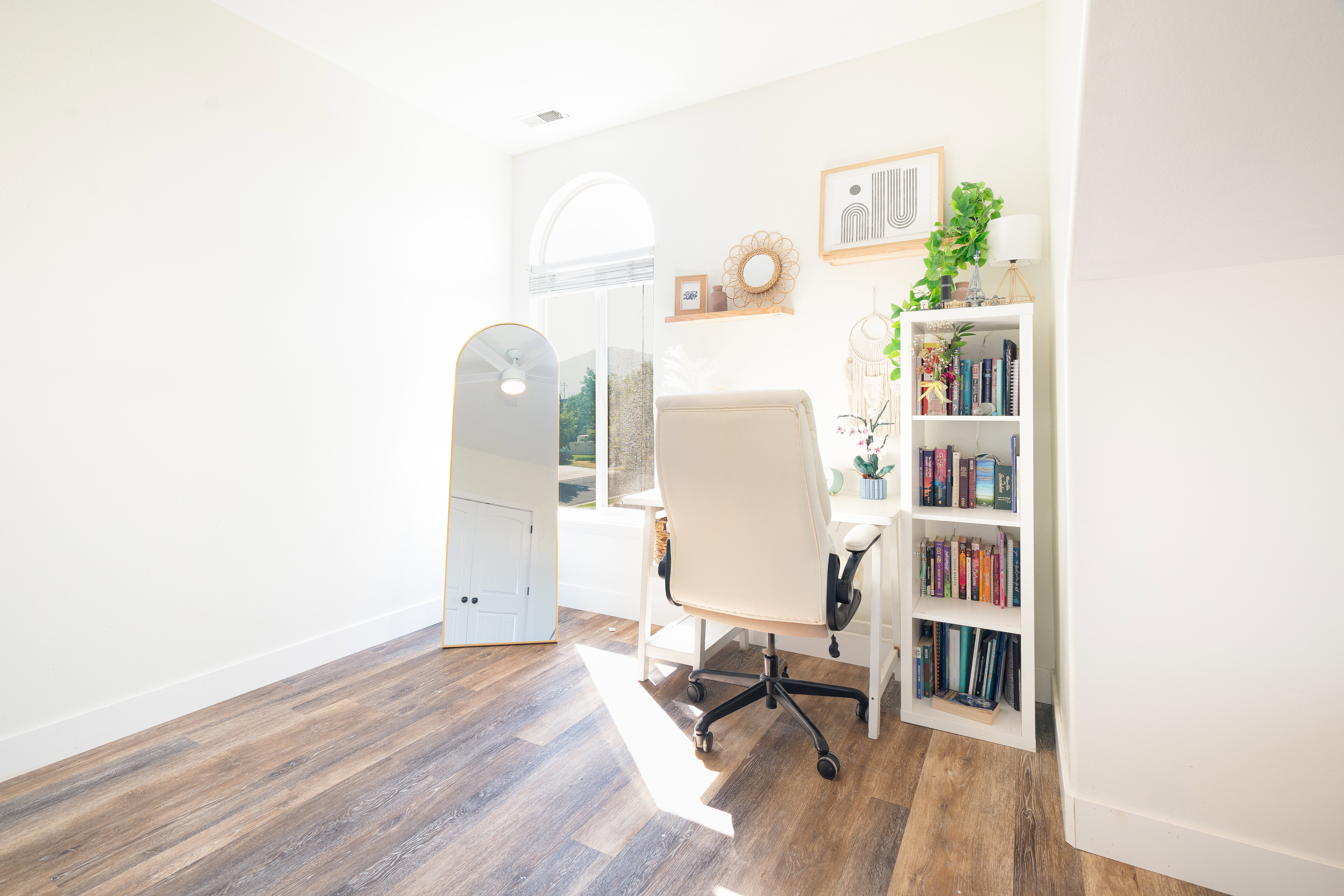 Office space featuring dark wood finished floors and baseboards