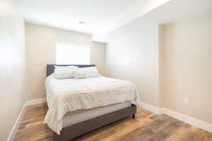Bedroom featuring light wood-type flooring and baseboards