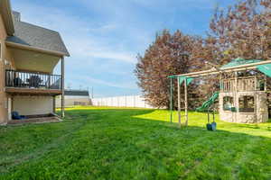 View of yard featuring a patio area and a playground