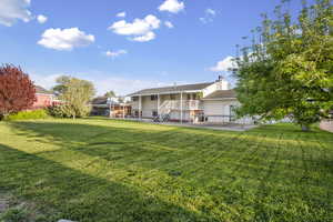 Back of property with a patio and a chimney