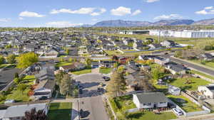 Aerial perspective of suburban area with a mountainous background