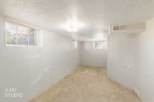 Bedroom with light colored carpet