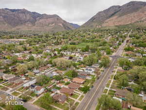Aerial perspective of suburban area featuring a mountain backdrop