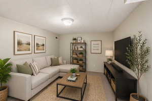 Virtually staged Den with light colored carpet