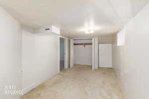 Finished below grade area featuring light carpet