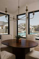 Dining area featuring hanging lights and lofted ceiling