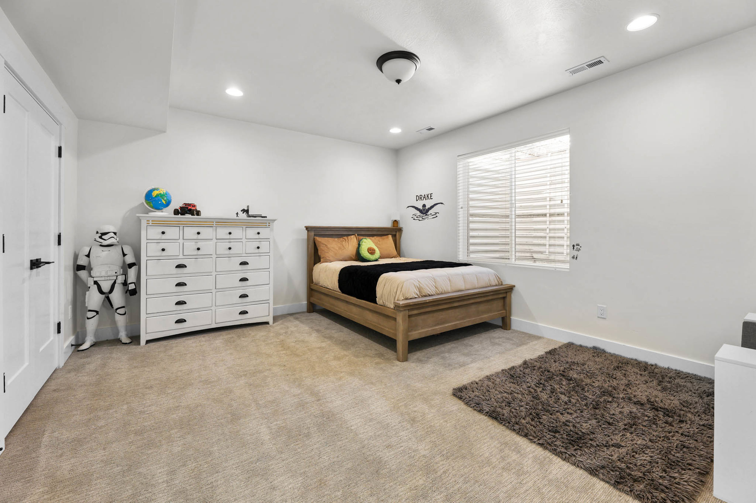 Bedroom featuring light carpet and recessed lighting