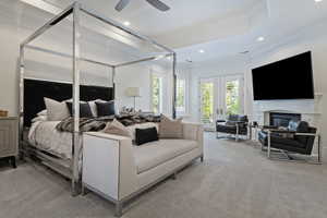 Main floor spacious primary suite with gas fireplace, and walkout to private patio