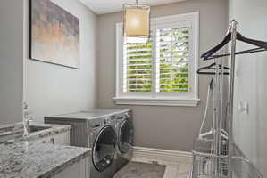 Main floor Laundry room with sink and built ins