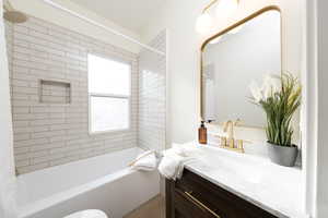 Full bathroom featuring vanity and shower / tub combo