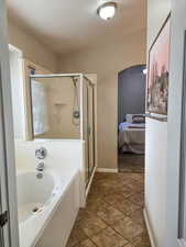 Ensuite bathroom with a shower stall and a garden tub