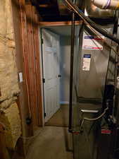 Utility room featuring heating unit