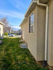 View of green lawn featuring a residential view and a mountain view