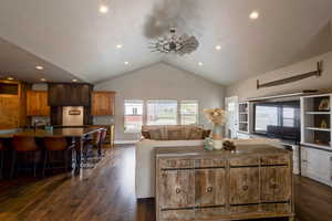 Living area with dark wood finished floors, a ceiling fan, and recessed lighting