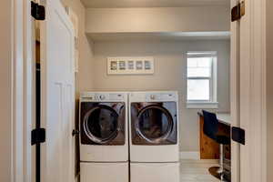 Laundry area featuring separate washer and dryer.