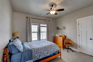 Bedroom with carpet floors and ceiling fan