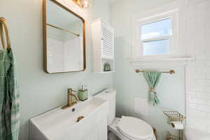 Bathroom with vanity and a shower with shower curtain