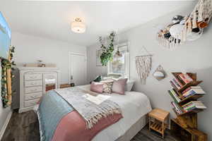 Bedroom with dark wood finished floors