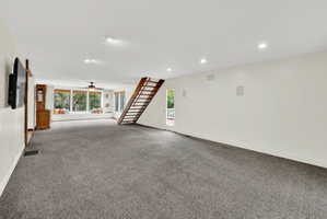 Below grade area featuring carpet, ceiling fan, and recessed lighting