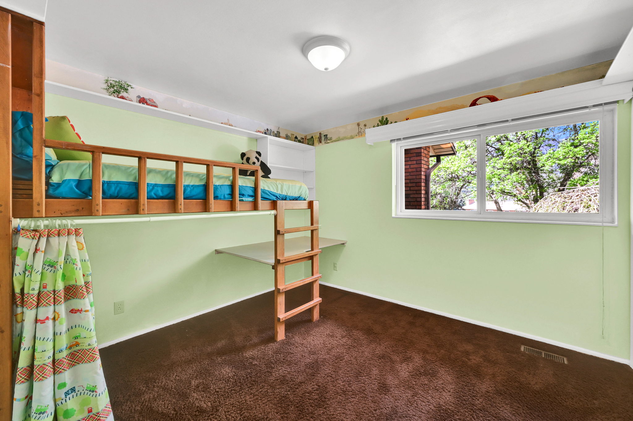 Unfurnished bedroom with dark carpet