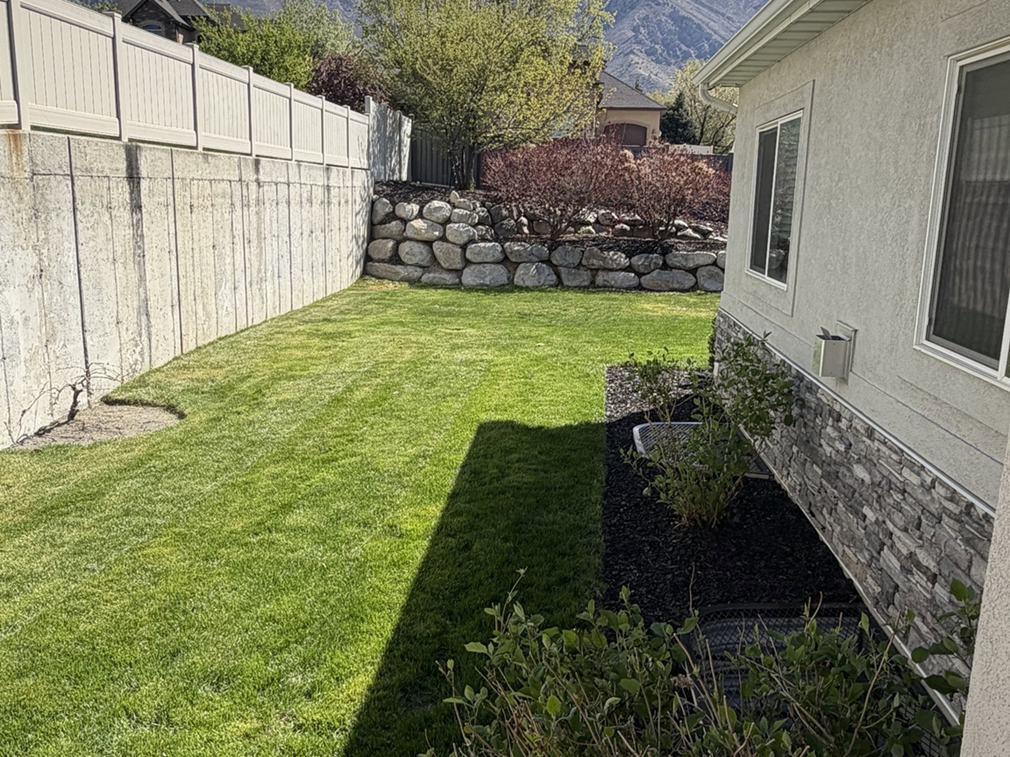 Fenced yard with a mountain view