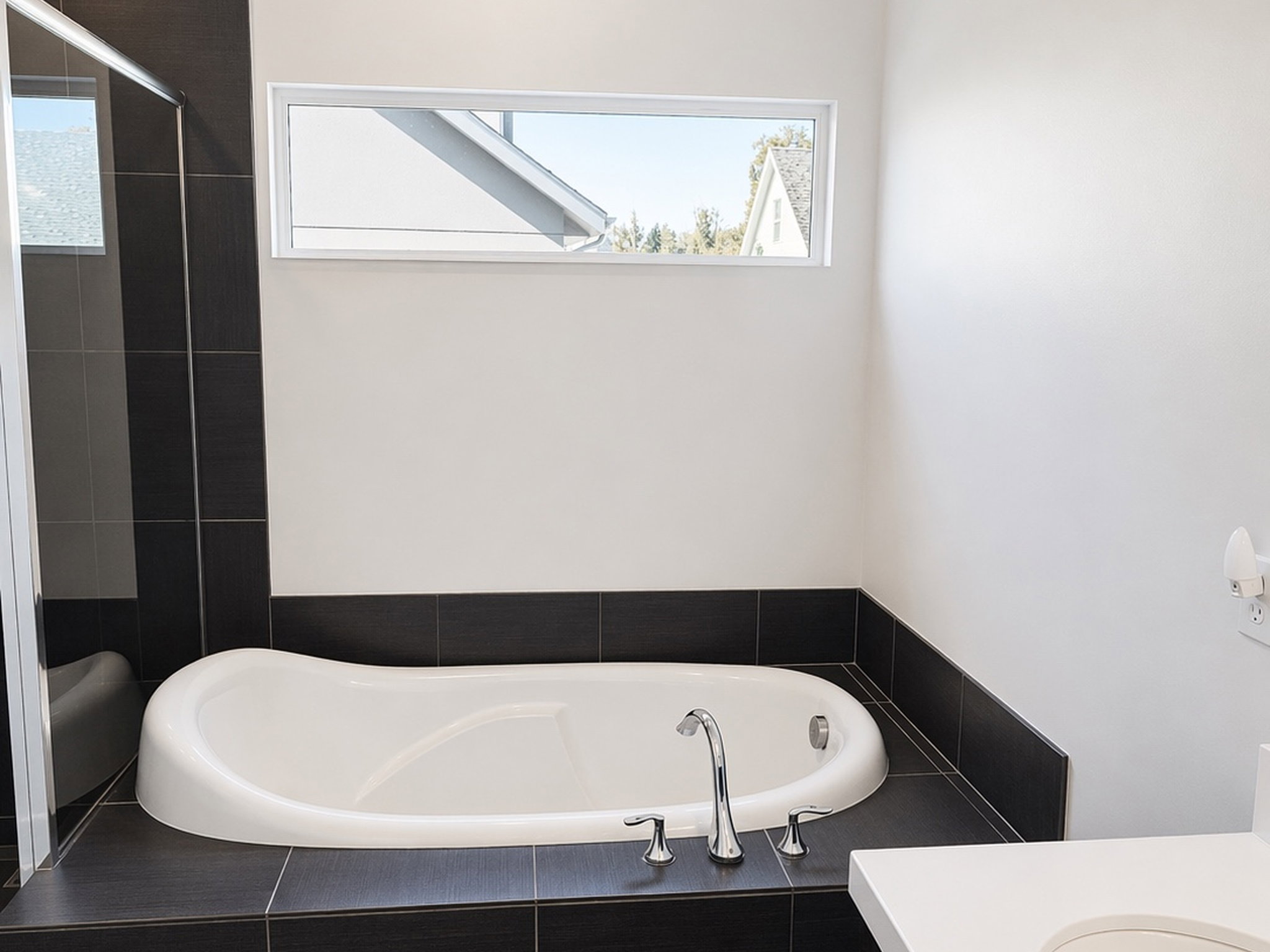 Full bath with a garden tub and vanity