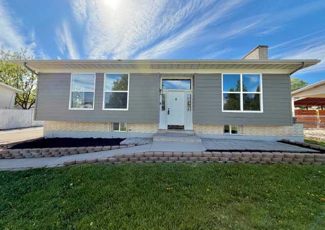 Front of house with new cement board siding