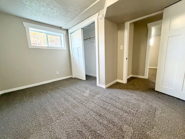 One of four basement bedrooms