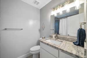 Bathroom featuring vanity and a shower with shower curtain