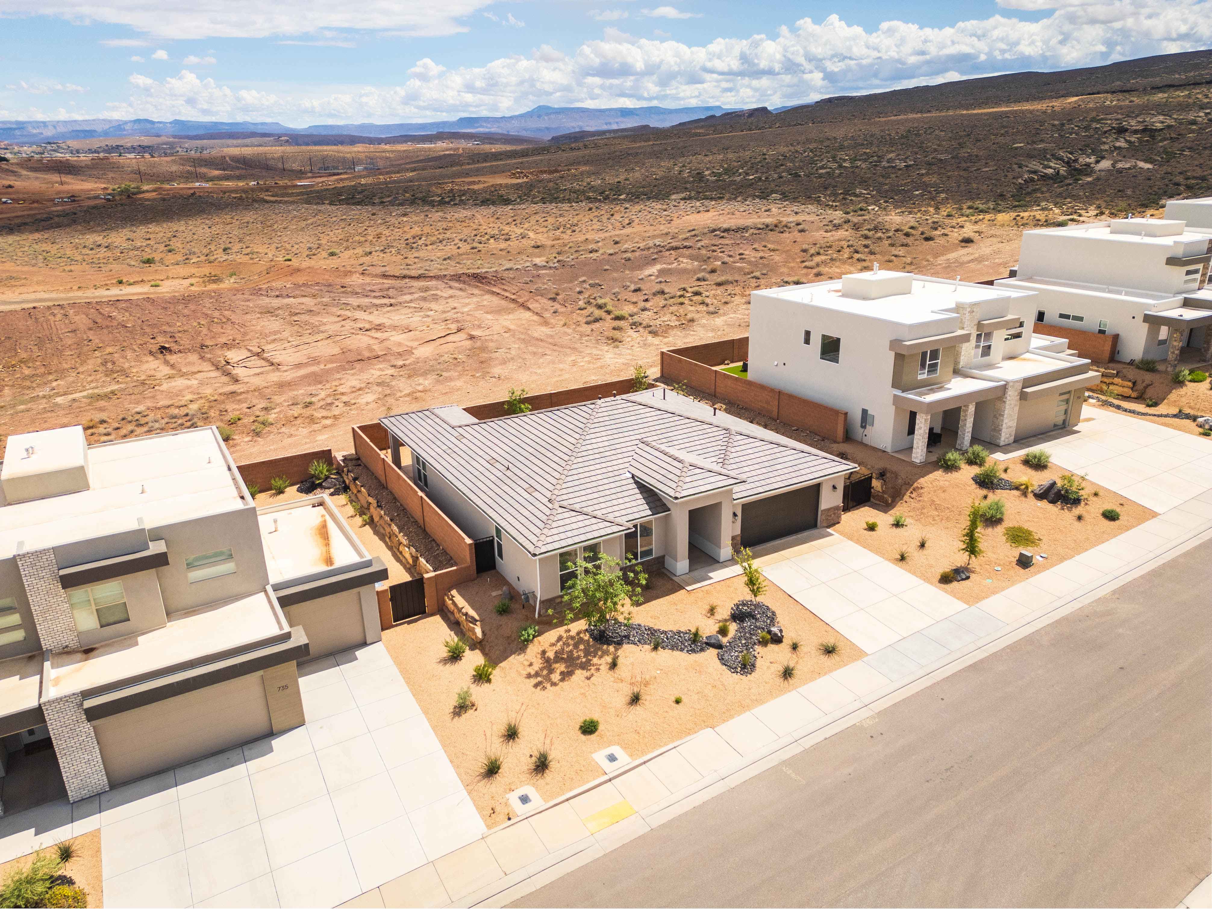 View of subject property with mountains and a desert landscape