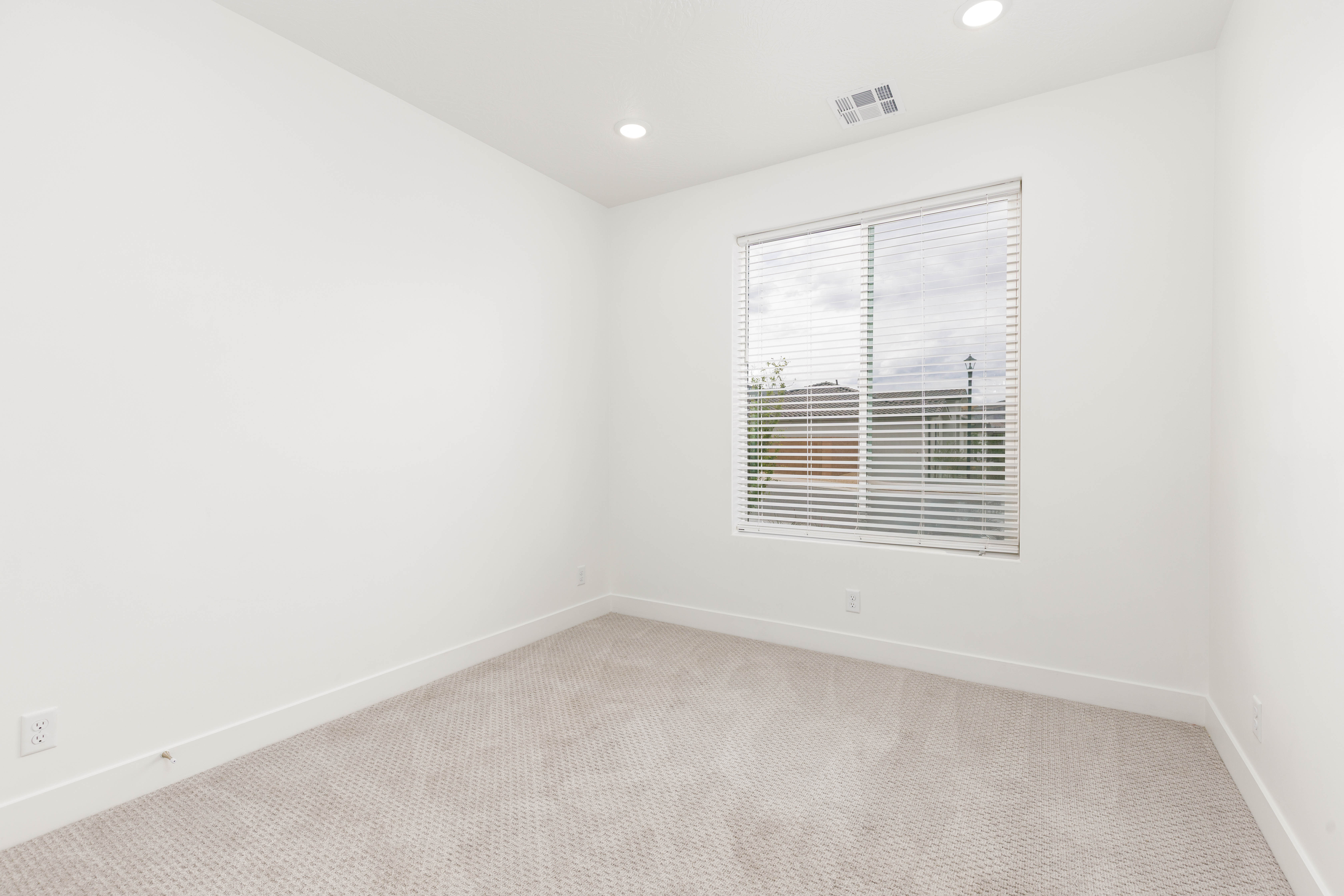 Unfurnished room featuring recessed lighting and light carpet