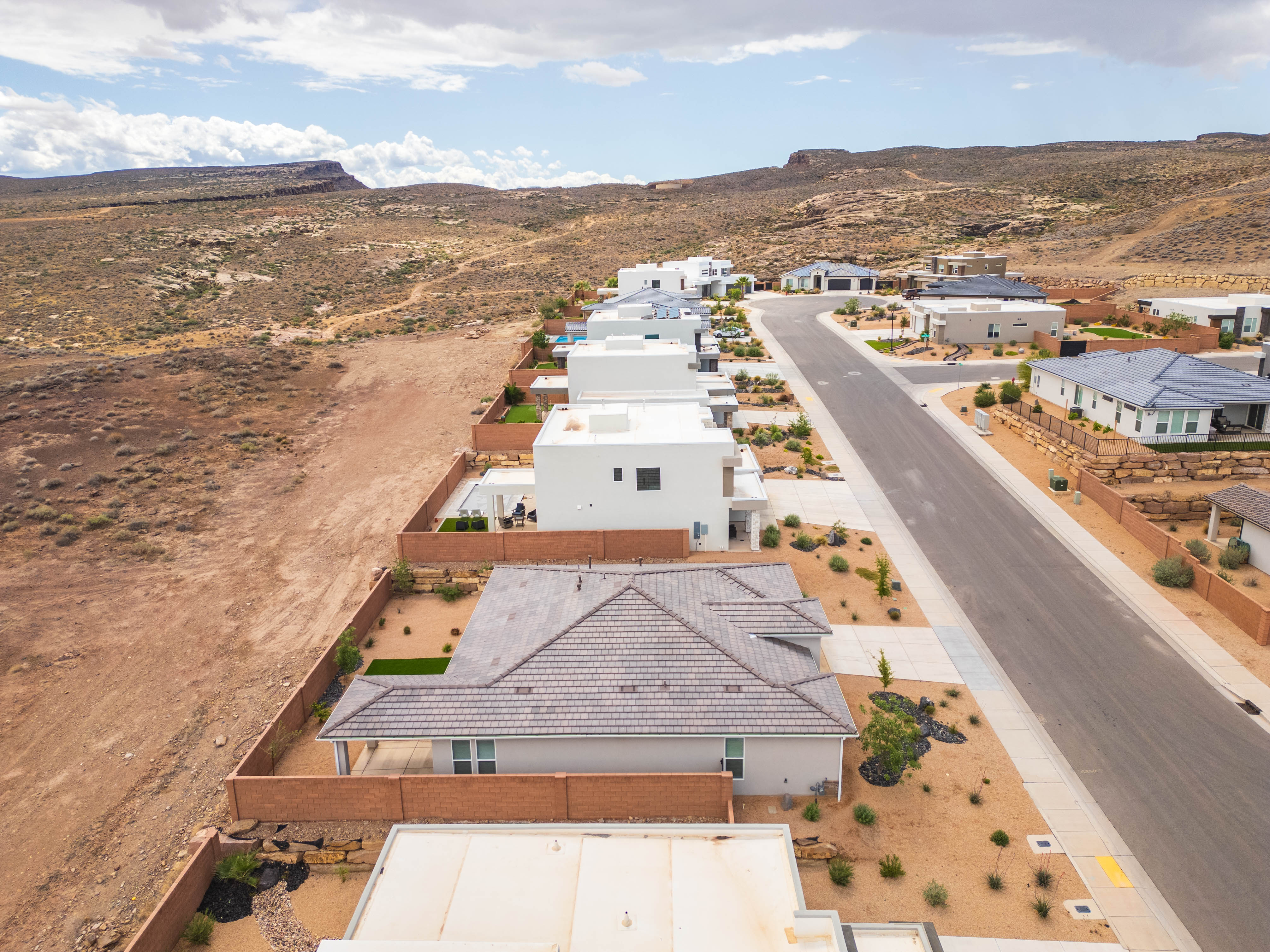 Aerial view of residential area featuring a mountainous background