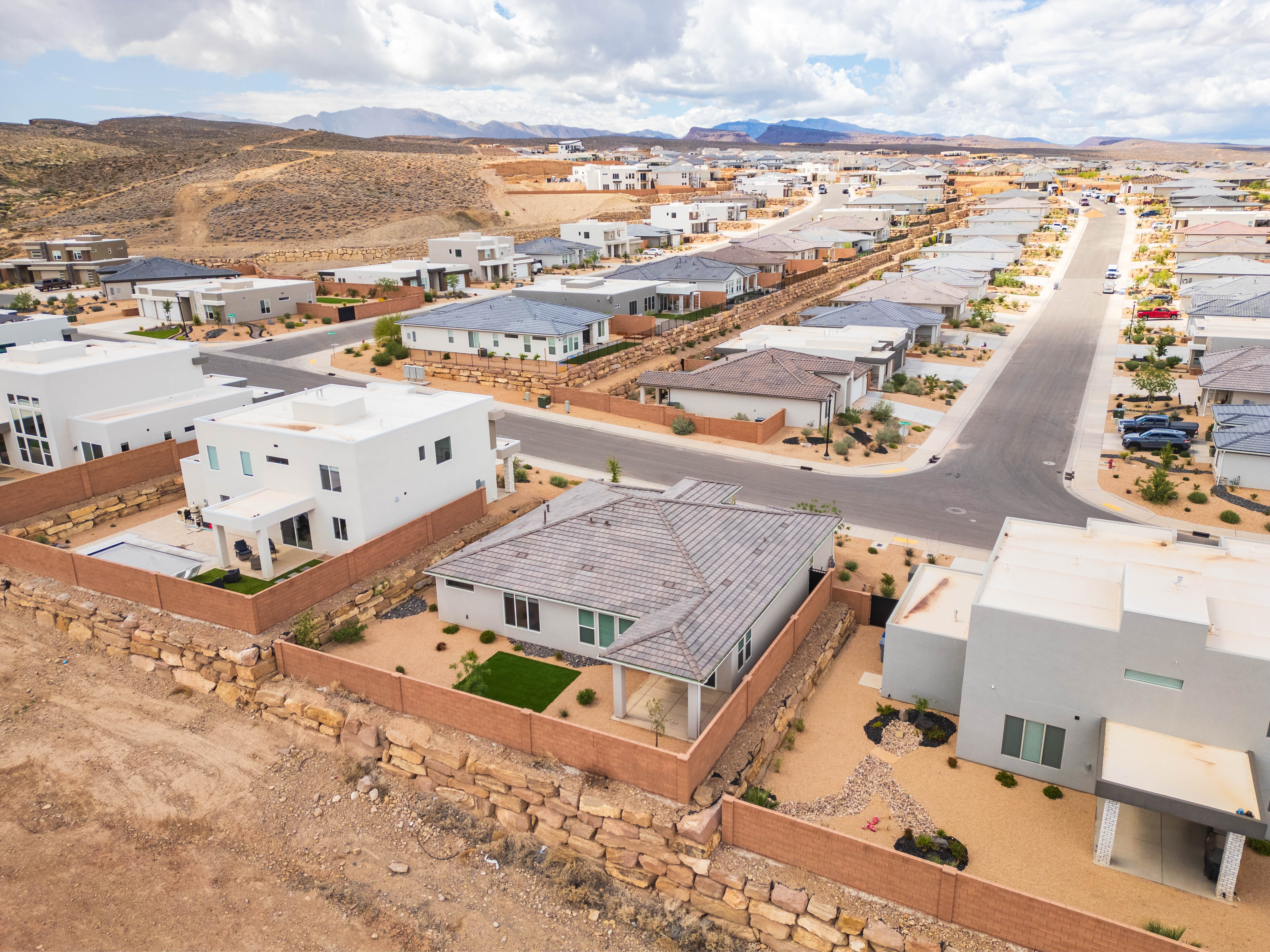 Aerial view of residential area featuring mountains
