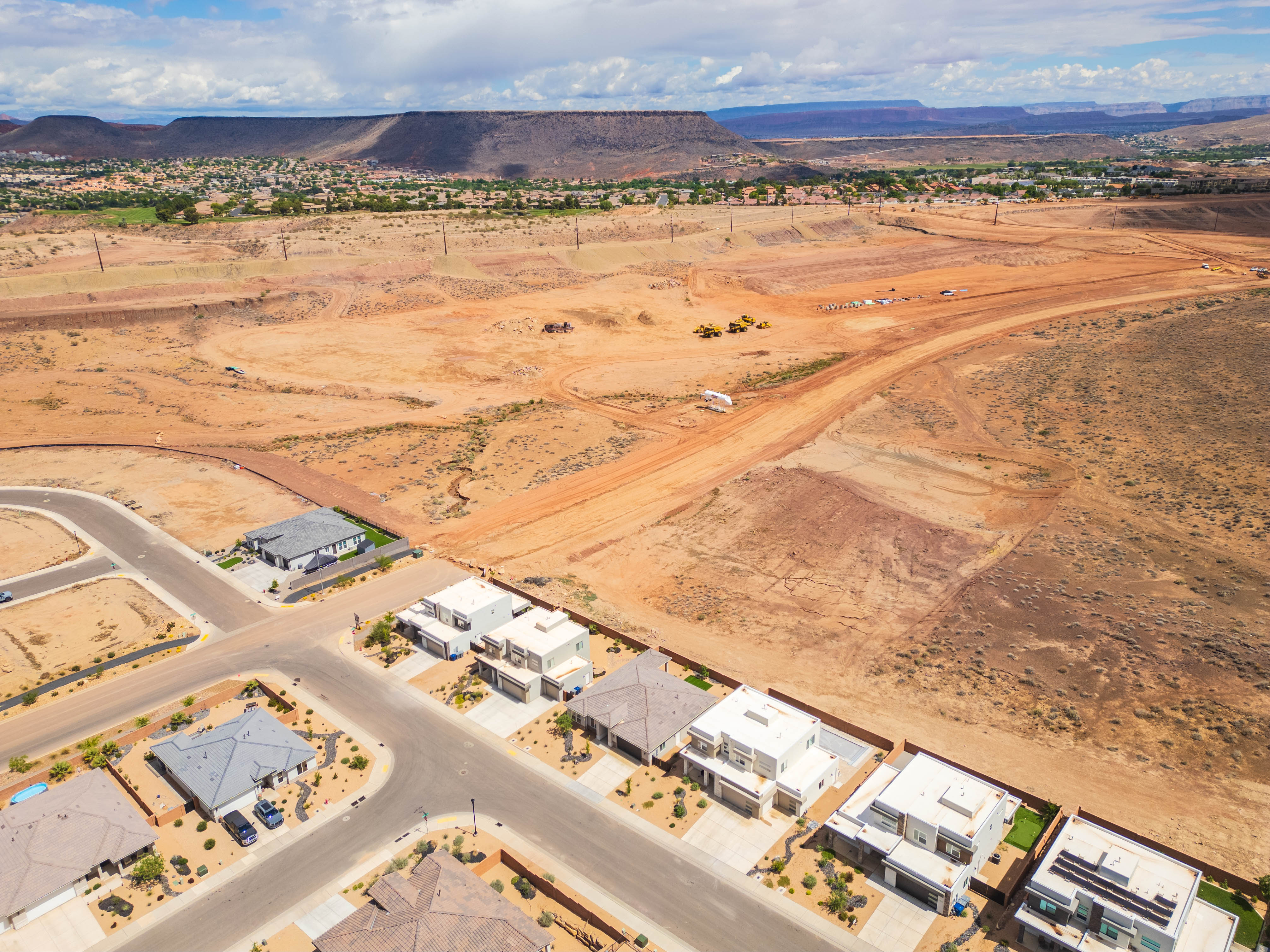 Aerial view of residential area featuring a mountainous background
