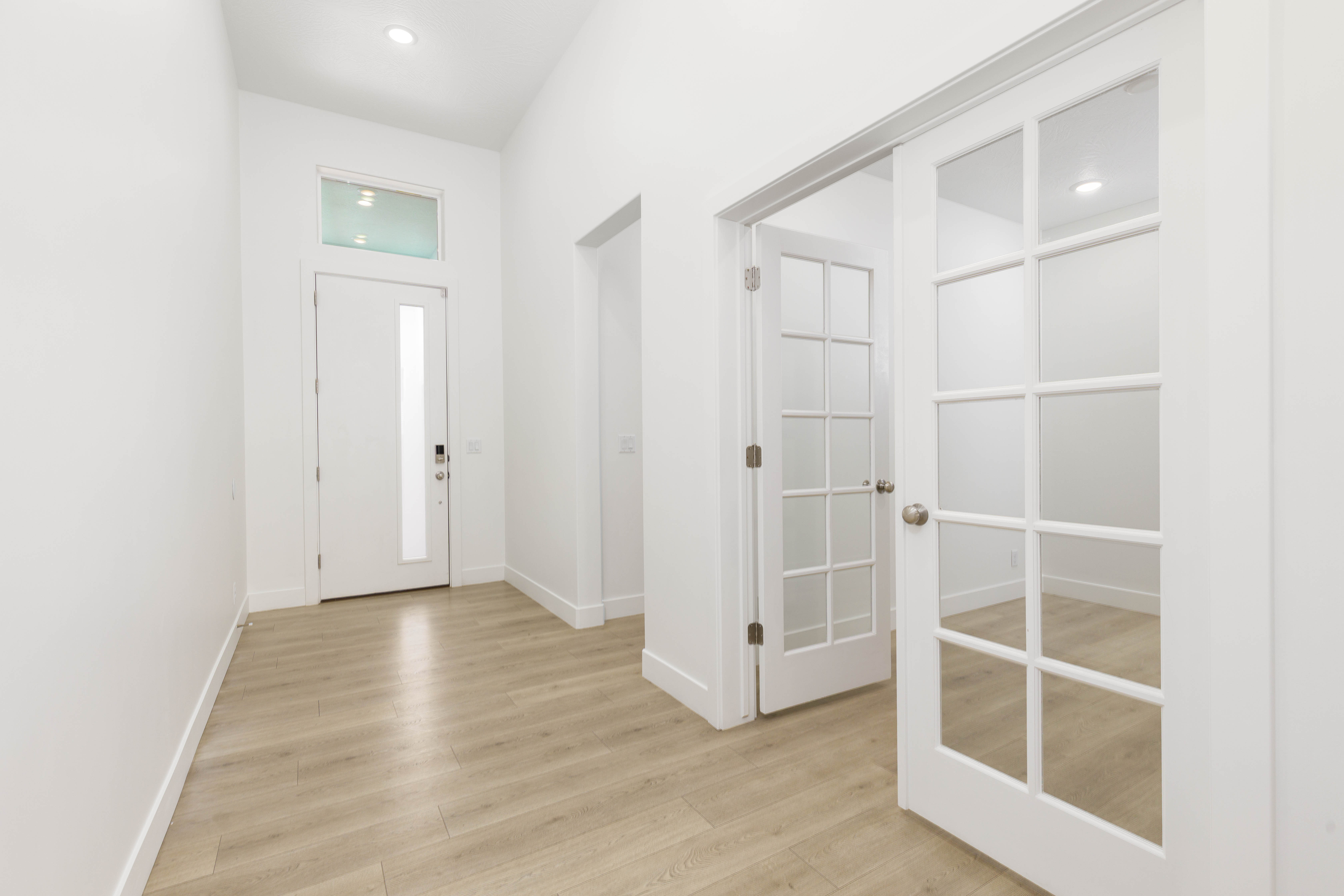 Entrance foyer featuring light wood-style flooring and recessed lighting