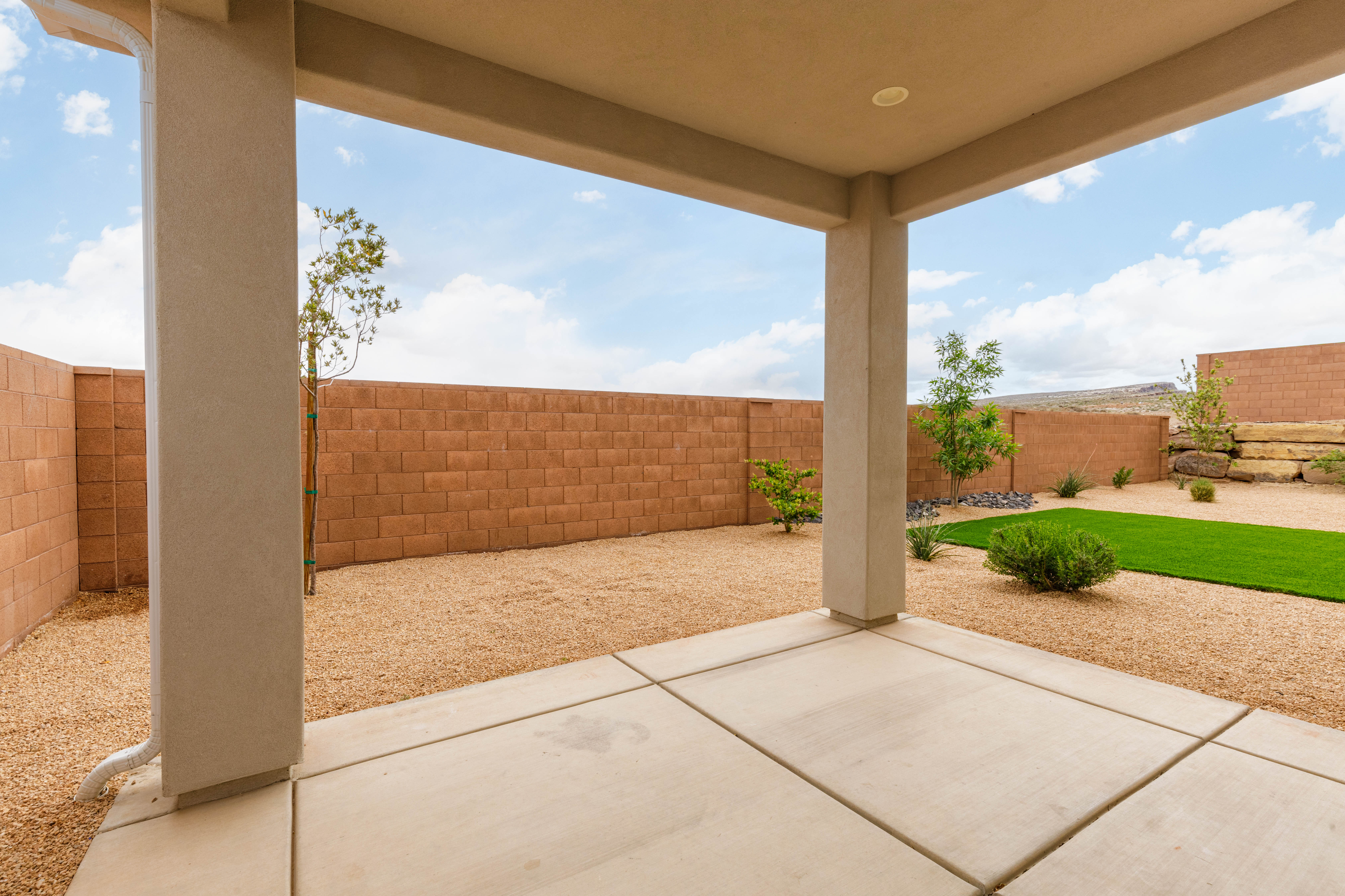 Fenced backyard featuring a patio