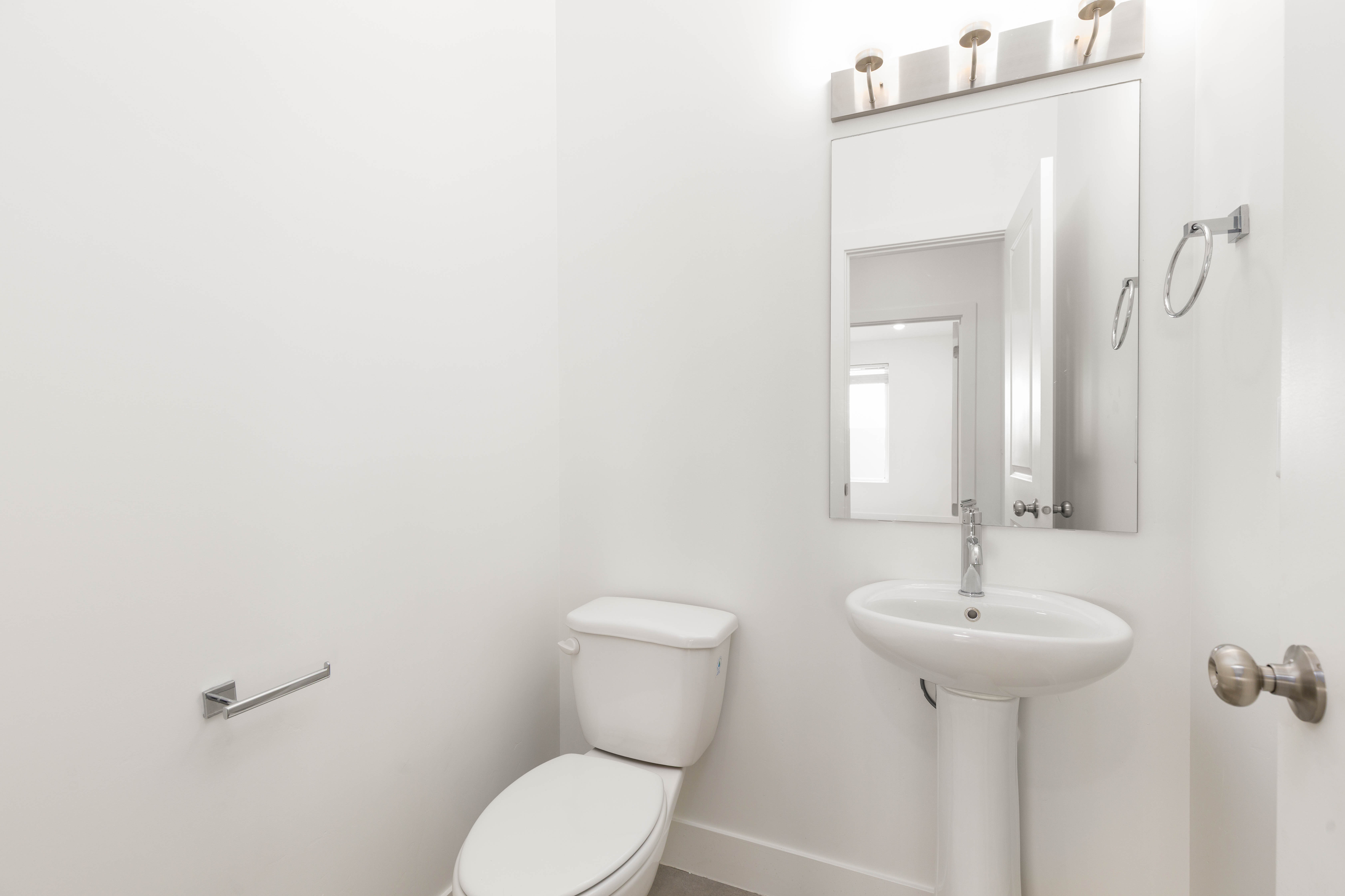 Bathroom with toilet and baseboards