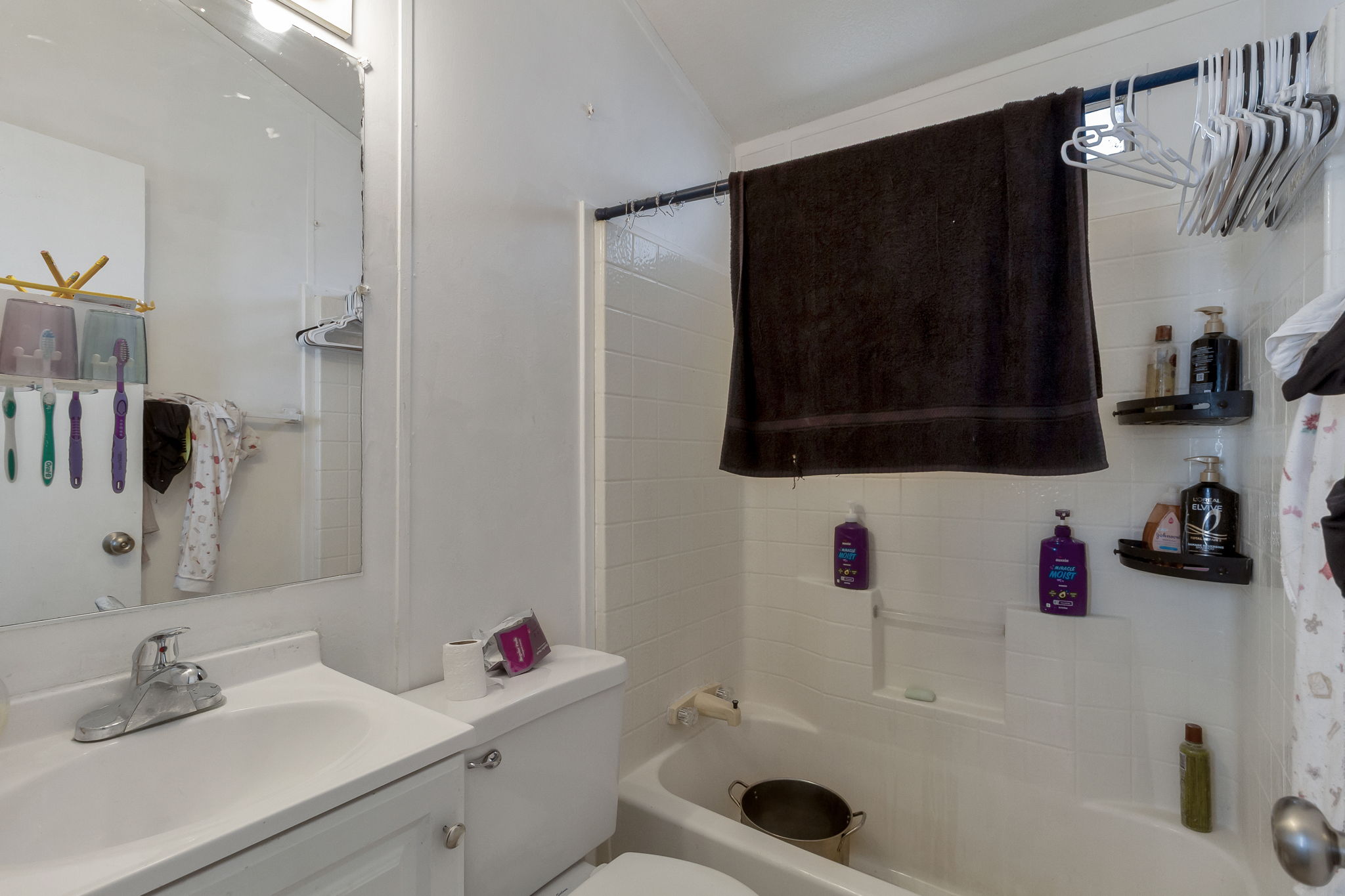 Full bath featuring vanity and shower / bath combination