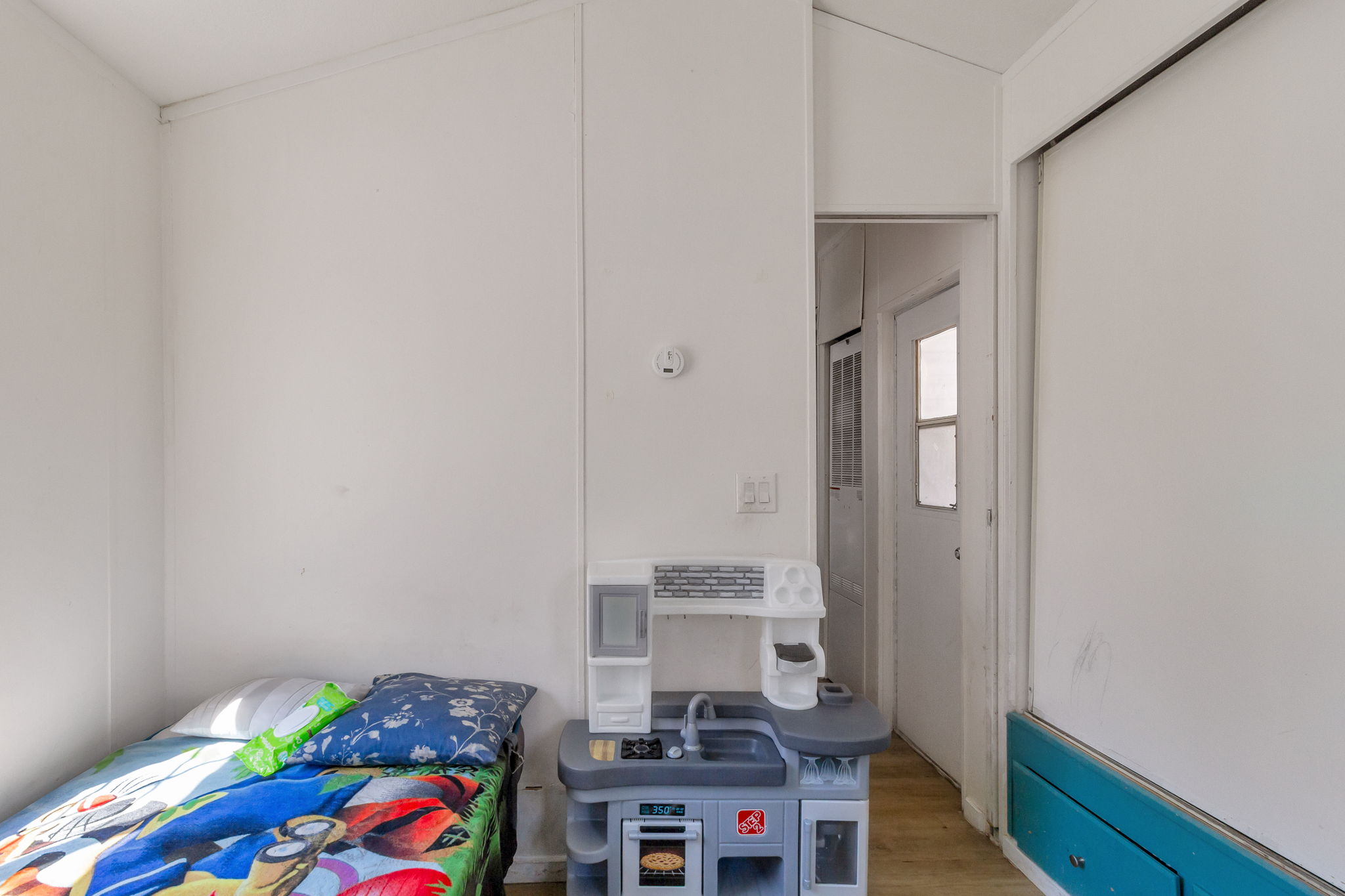 Bedroom with wood finished floors