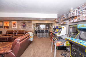 Living room with a bar and carpet floors