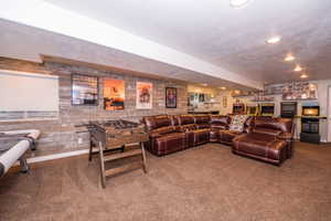 Carpeted living room featuring recessed lighting