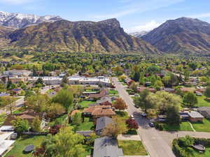 Aerial perspective of suburban area with a mountainous background