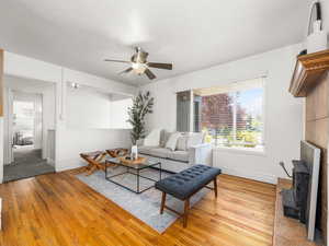 Family room with light wood-type flooring and ceiling fan